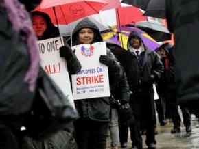Members of Amalgamated Transit Union Local 1181 walk the picket line